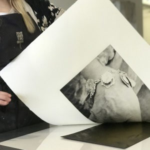 A person holding a print