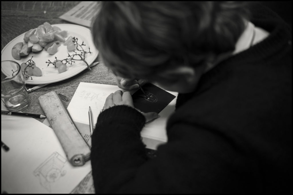 Student creating art in black and white image