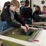 Group of people screen printing