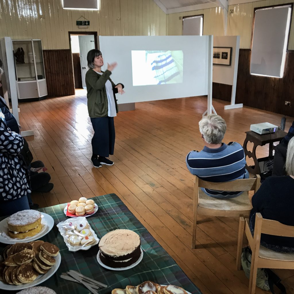 A person teaching students about the artwork